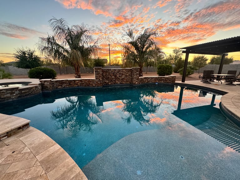 Desert pool at sunset